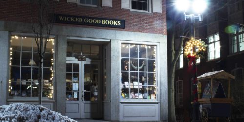 The small windows of the Wicked Good Books shop are classic small town bookshop, the ghosts in the basement, are unique to Salem.