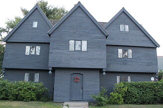 photo shows the facade of the deep black salem witch house